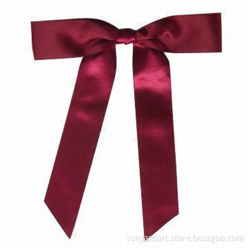 Polyester ribbon hand tied gift bow with adhesive tab at back, burgundy color
